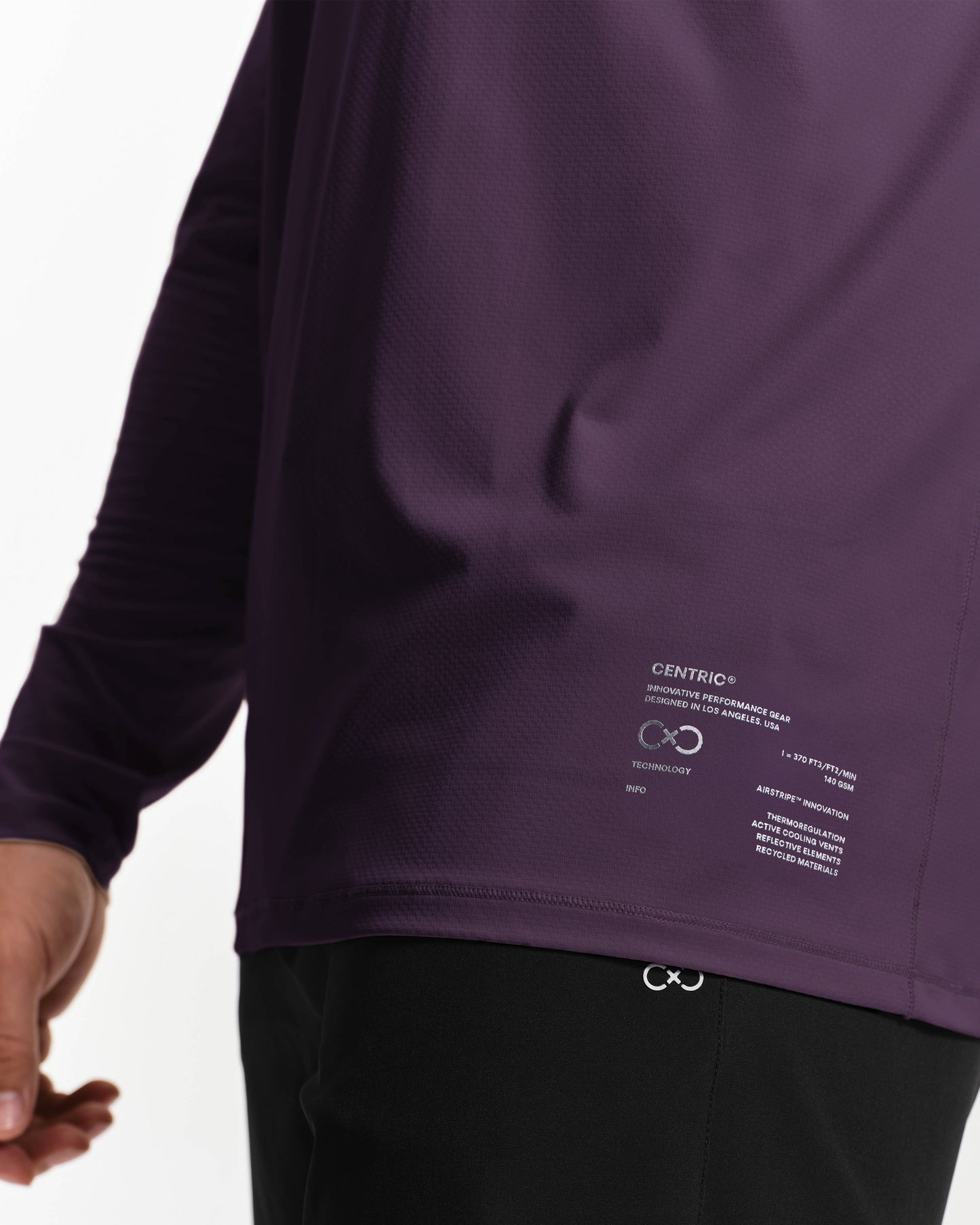 Purple long-sleeve shirt with brand logo and text on a white background